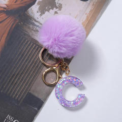 Cute purple color fluffy ball initial letter keychain