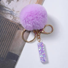 Cute purple color fluffy ball initial letter keychain