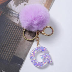 Cute purple color fluffy ball initial letter keychain