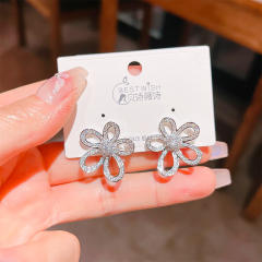Delicate diamond flower hollow out studs earrings