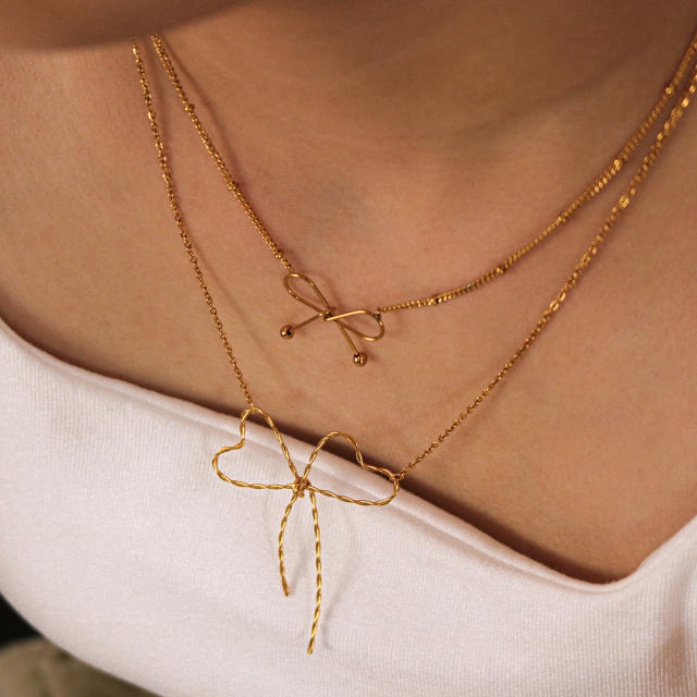 18KG hot sale hollow out bow stainless steel necklace earrings set