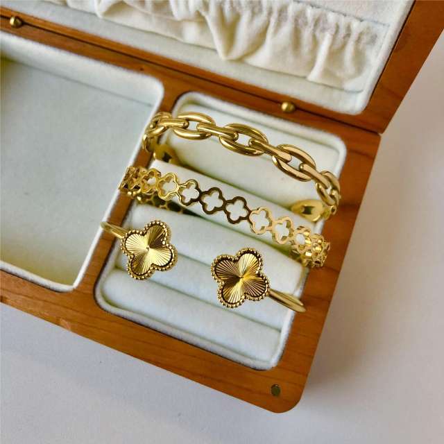 Hot sale gold color clover hollow out stainless steel cuff bangle