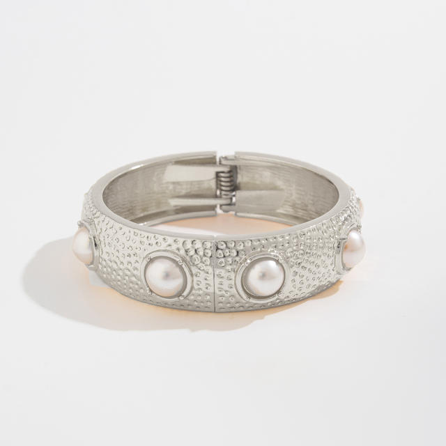 Chunky metal imitation pearl twist spring buckle bangle bracelet