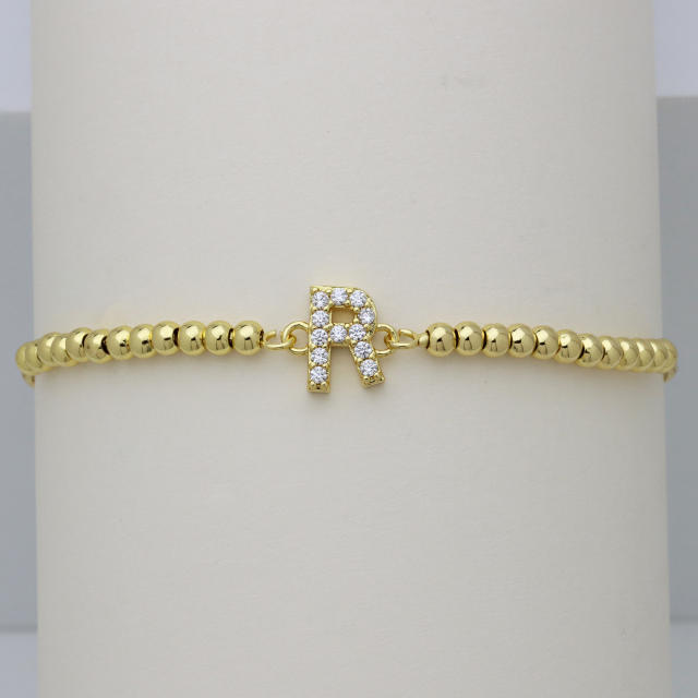 Delicate diamond initial letter gold plated copper bead bracelet