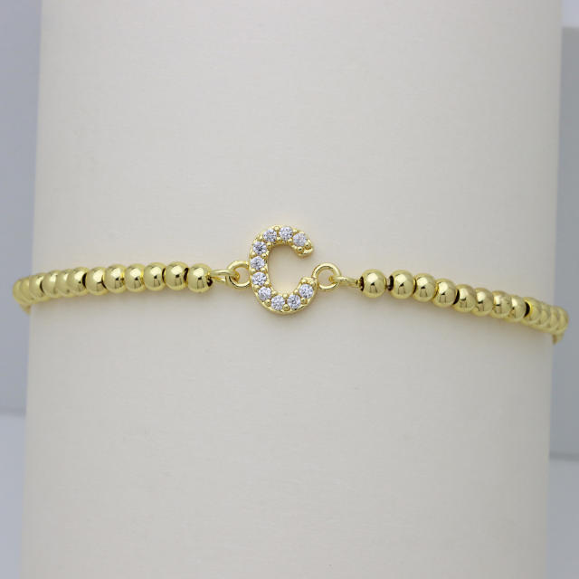 Delicate diamond initial letter gold plated copper bead bracelet