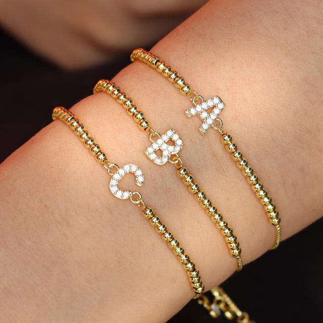 Delicate diamond initial letter gold plated copper bead bracelet