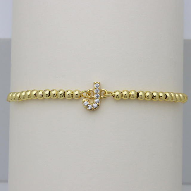 Delicate diamond initial letter gold plated copper bead bracelet