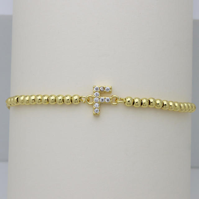 Delicate diamond initial letter gold plated copper bead bracelet