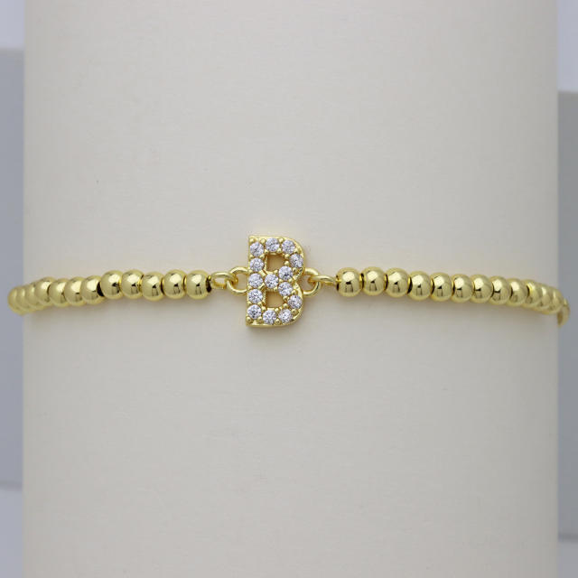 Delicate diamond initial letter gold plated copper bead bracelet