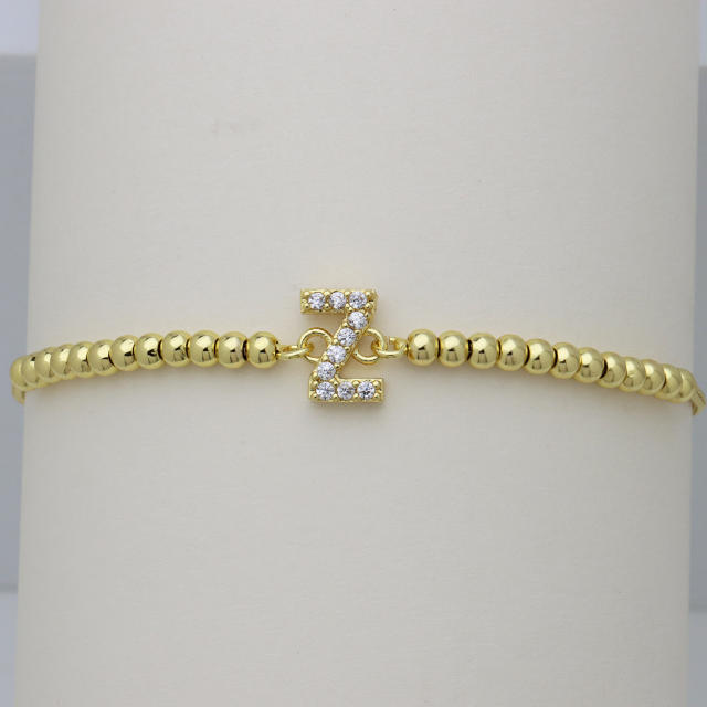 Delicate diamond initial letter gold plated copper bead bracelet