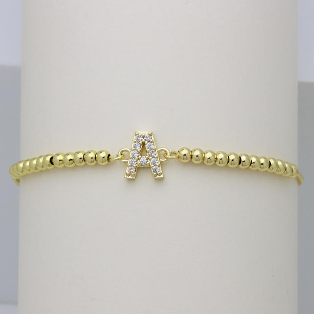 Delicate diamond initial letter gold plated copper bead bracelet