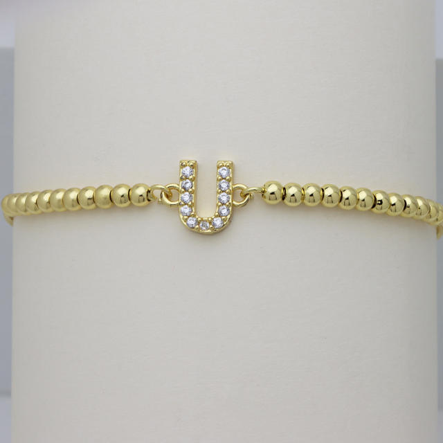 Delicate diamond initial letter gold plated copper bead bracelet