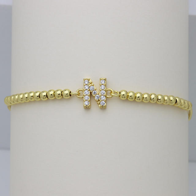 Delicate diamond initial letter gold plated copper bead bracelet