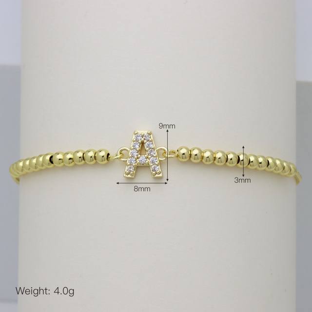 Delicate diamond initial letter gold plated copper bead bracelet
