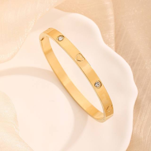 18KG classic hollow clover nail pattern stainless steel bracelet bangle