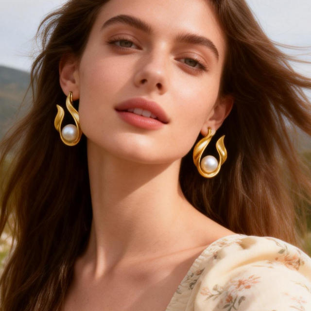 Elegant pearl inlaid unique drop shape stainless steel earrings