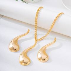 Exaggerated gold color drop design metal necklace earrings set