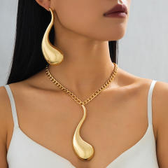 Exaggerated gold color drop design metal necklace earrings set