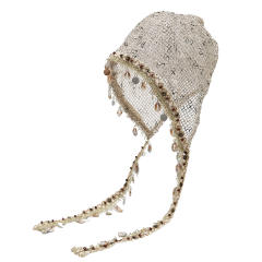 Bohemian-style slouchy beanie cap with cutouts shells tassels