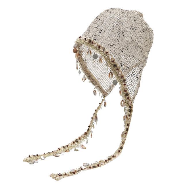 Bohemian-style slouchy beanie cap with cutouts shells tassels