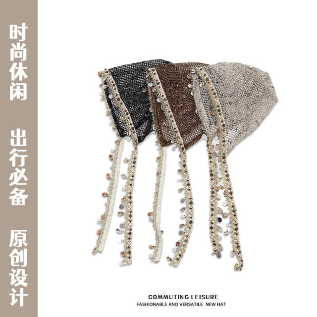 Bohemian-style slouchy beanie cap with cutouts shells tassels