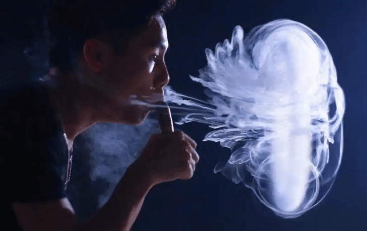 A man is doing jellyfish vape trick 