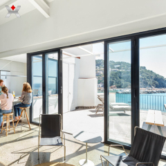 Why is it recommended to use heat-insulating aluminum profiles for aluminum alloy doors and windows?