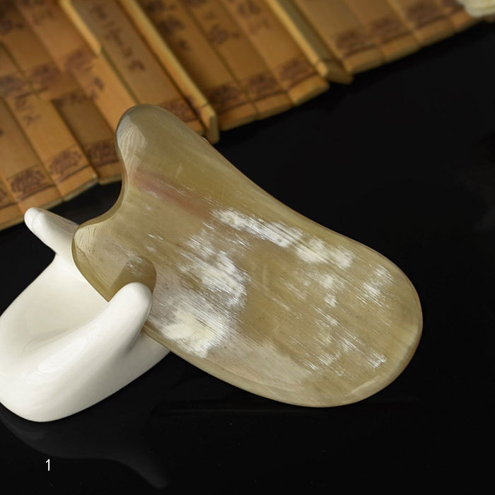 Patterned horn scraping massage tool