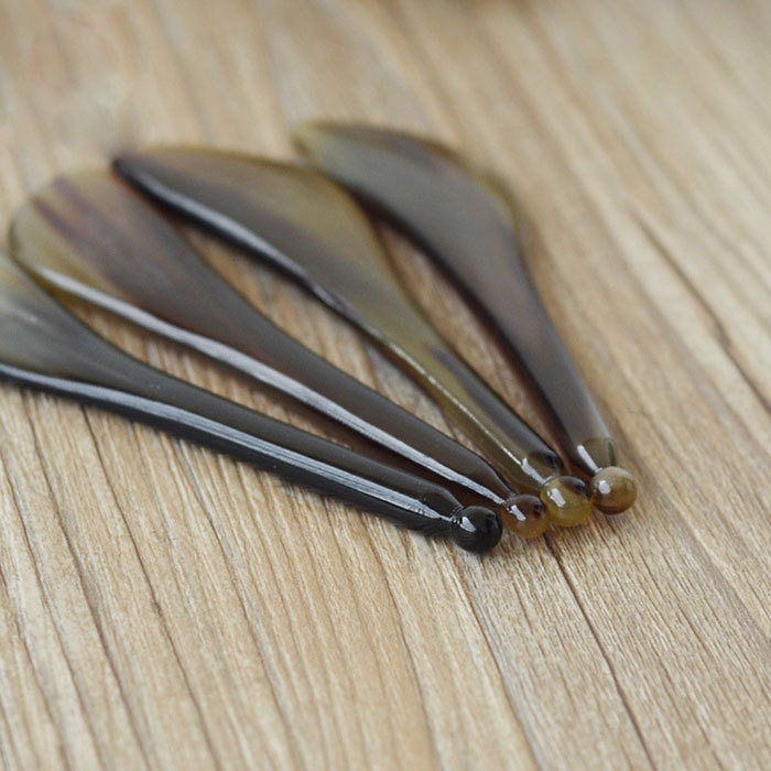 Ox horn eye scraping point massage pen