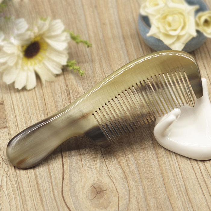 Black color small horn massage comb