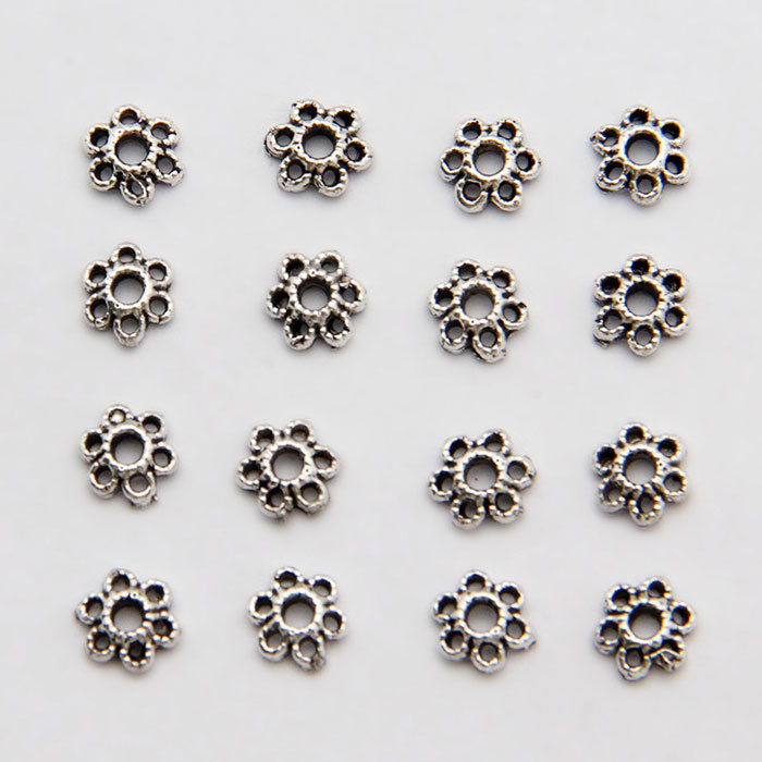 Exquisite six-petaled torus spacer