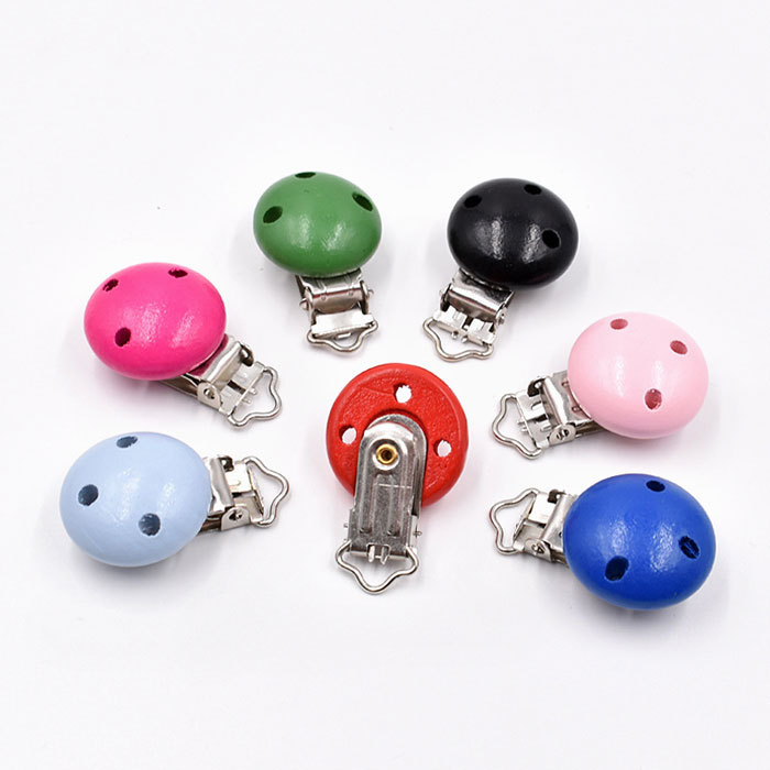 Colored wooden pacifier clips