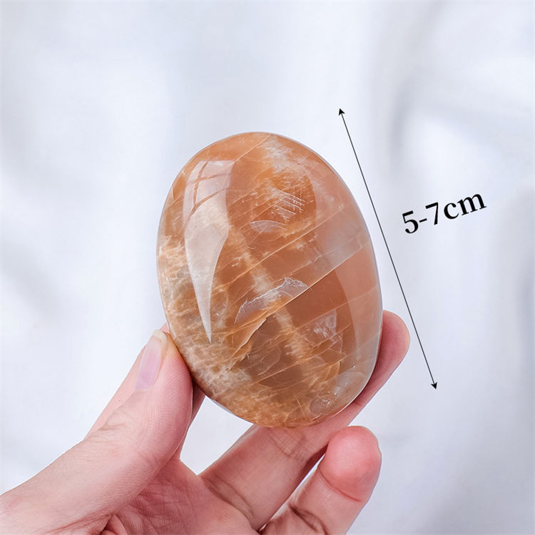 Natural orange moonstone massage stone