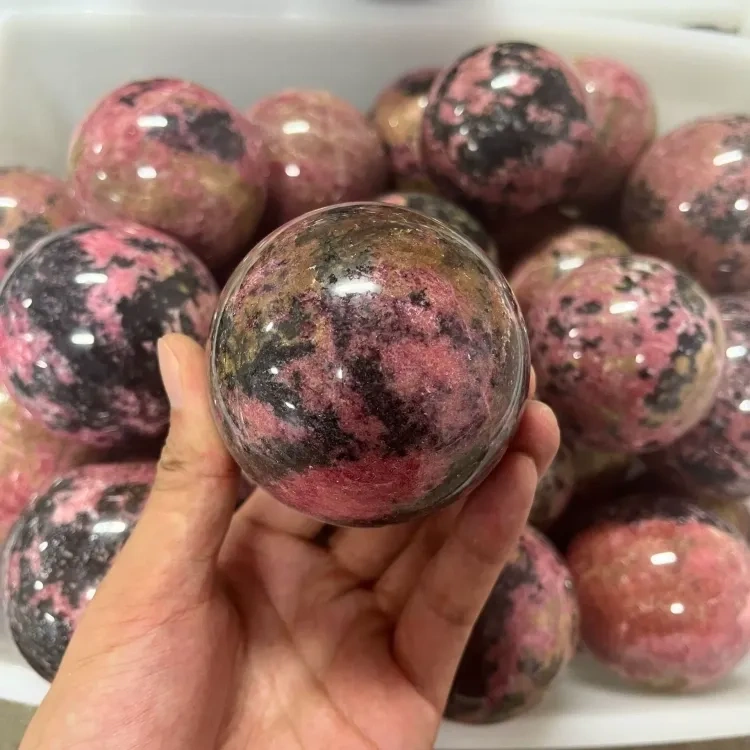 Natural crystal Rhodonite sphere 1kg