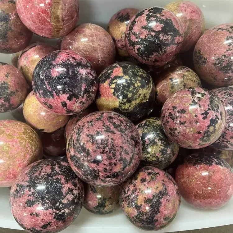Natural crystal Rhodonite sphere 1kg