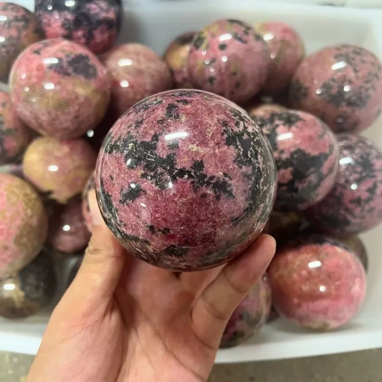 Natural crystal Rhodonite sphere 1kg