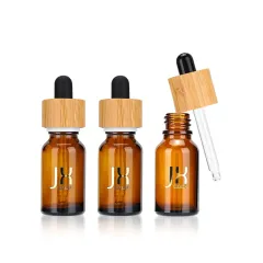 Custom Logo Essential Oil Bottle Frosted Amber Skin Care Serum Bottle Childproof Bamboo Cap Glass Oil Dropper Bottle