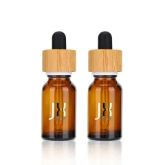 Custom Logo Essential Oil Bottle Frosted Amber Skin Care Serum Bottle Childproof Bamboo Cap Glass Oil Dropper Bottle
