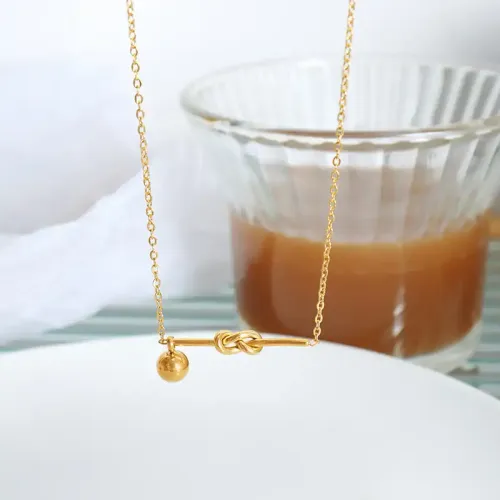 FXNT1209 Chic Gold-Plated Knot Pendant Necklace with Geometric Steel Ball Design
