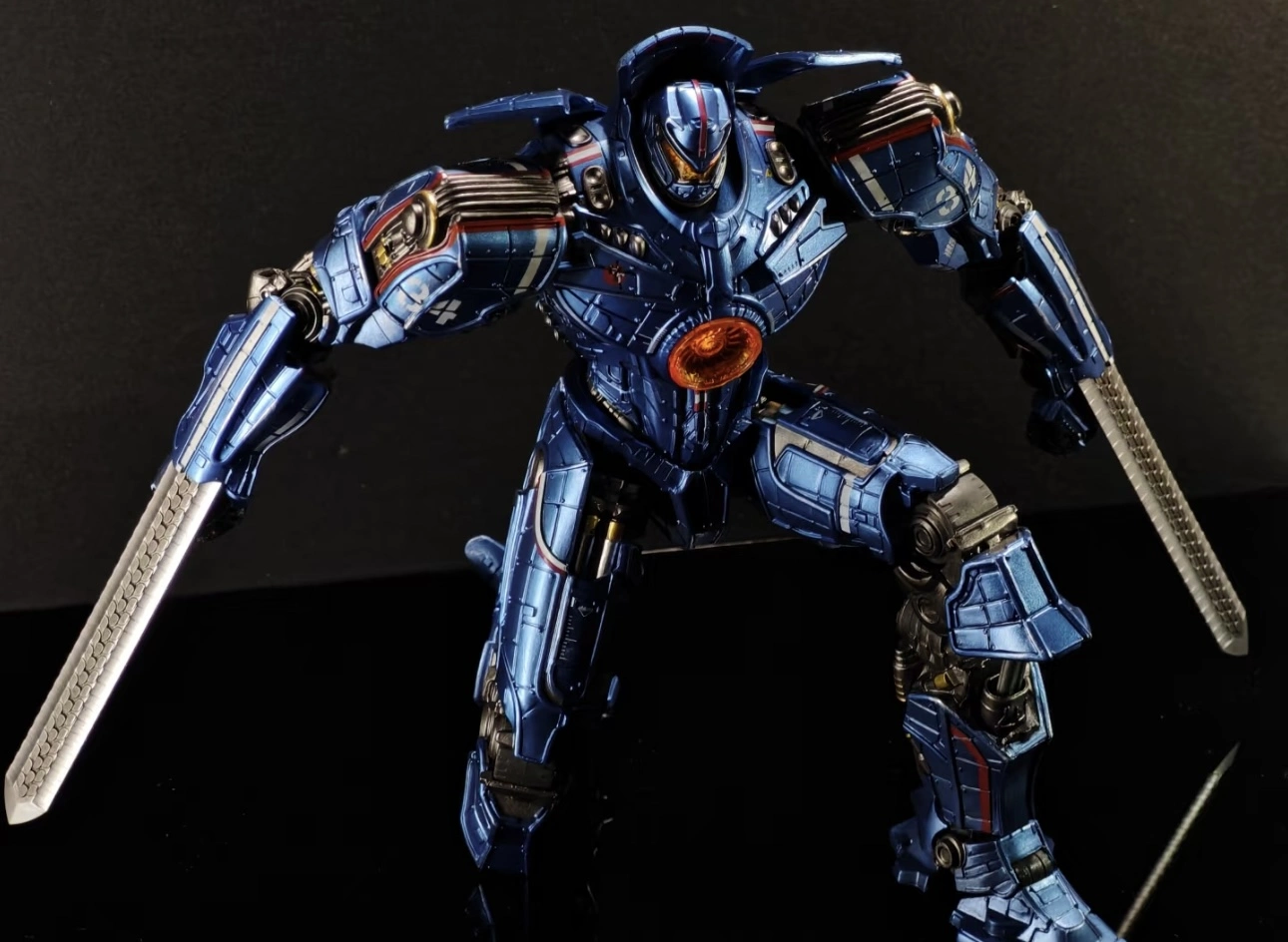 GipsyDanger in the Pacific Rim is half-kneeling with his weapon ready for battle.