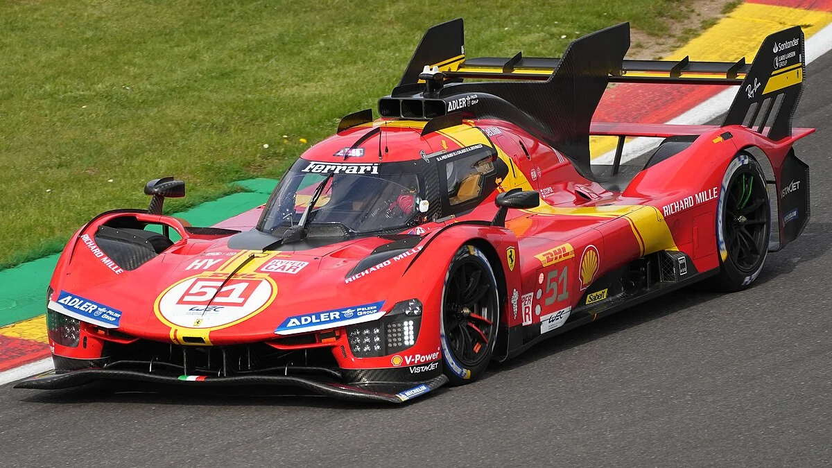 The Ferrari 499P is speeding on the track.