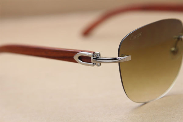 Cartier Rimless T8300680 Original Wood Sunglasses in Gold Brown Lens