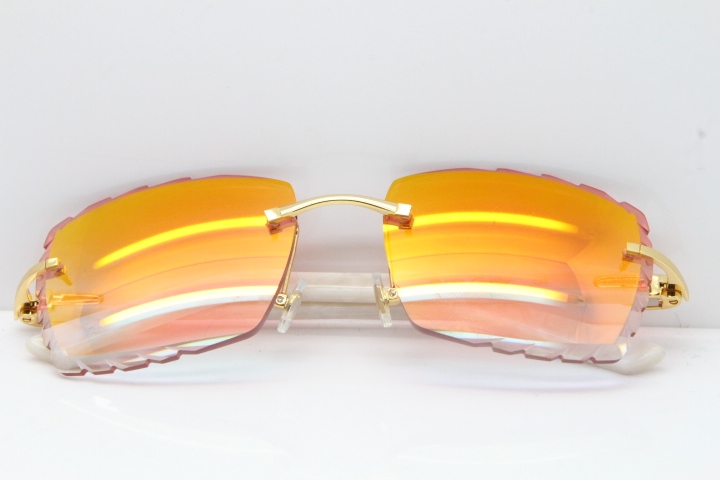 Cartier Rimless Aztec Arms 8300816 Carved Lens Sunglasses In Gold Red Mirror Lens