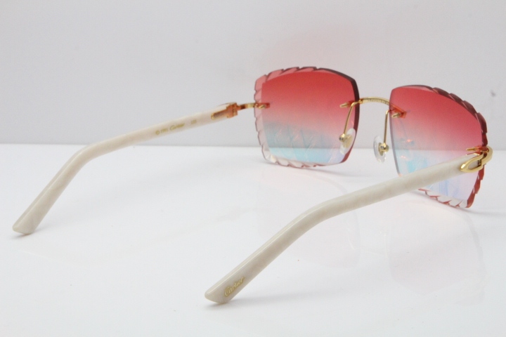 Cartier Rimless Aztec Arms 8300816 Carved Lens Sunglasses In Gold Red Mirror Lens
