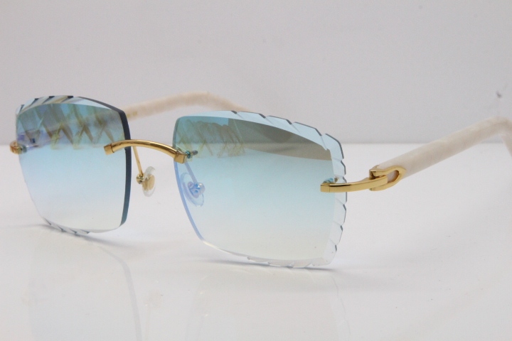 Cartier Rimless Aztec Arms 8300816 Carved Lens Sunglasses In Gold Ice Blue Lens