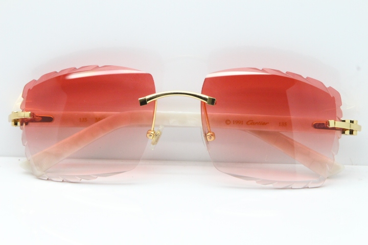 Cartier Rimless Aztec Arms 8300816 Carved Lens Sunglasses In Gold Red Lens