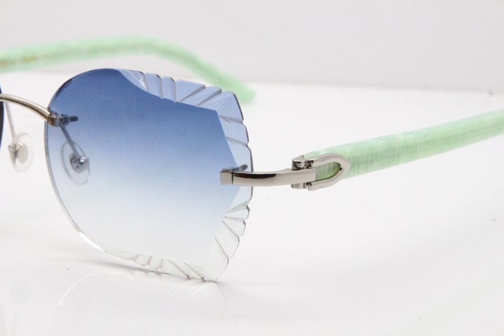 Cartier Rimless T8200762 Marble Green Aztec Arms Sunglasses In Gold Blue Lens