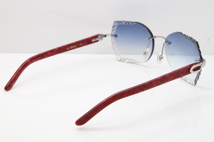 Cartier Rimless T8200762 Marble Red Aztec Arms Sunglasses In Gold Blue Lens