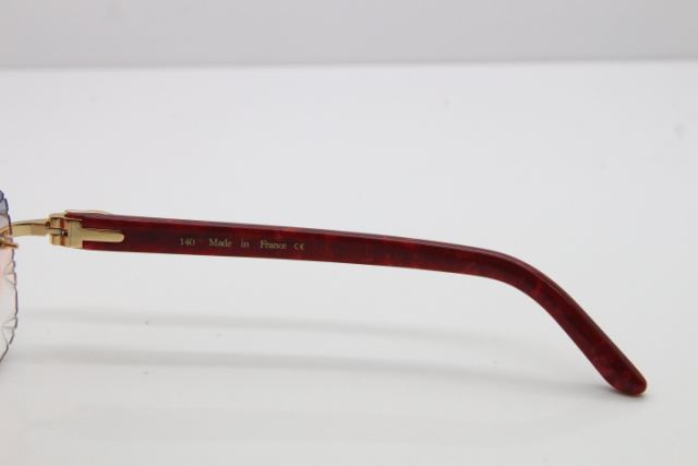 Cartier Rimless 8300816 Marble Red Aztec Arms Sunglasses In Gold Orange Lens
