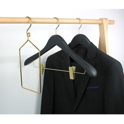Black hotel wooden hangers with gold hook and clips